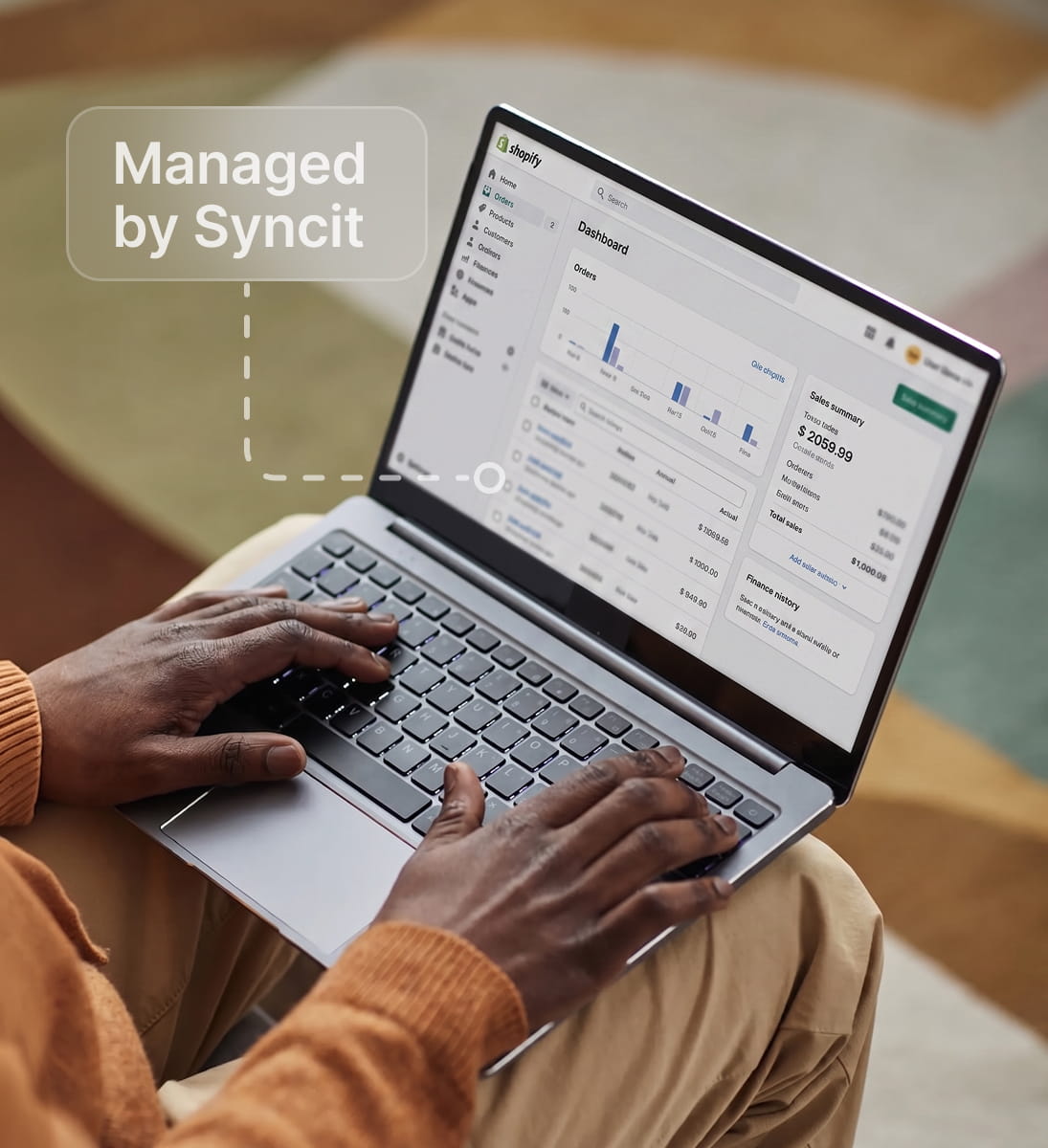 Managed NetSuite to Shopify sync running on a laptop dashboard